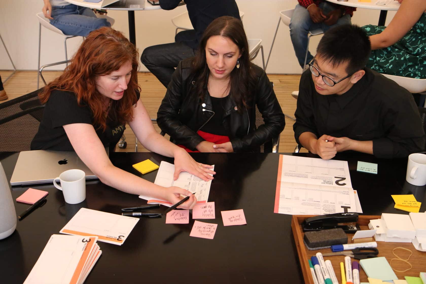 Three IA collaborators brainstorm a prototype