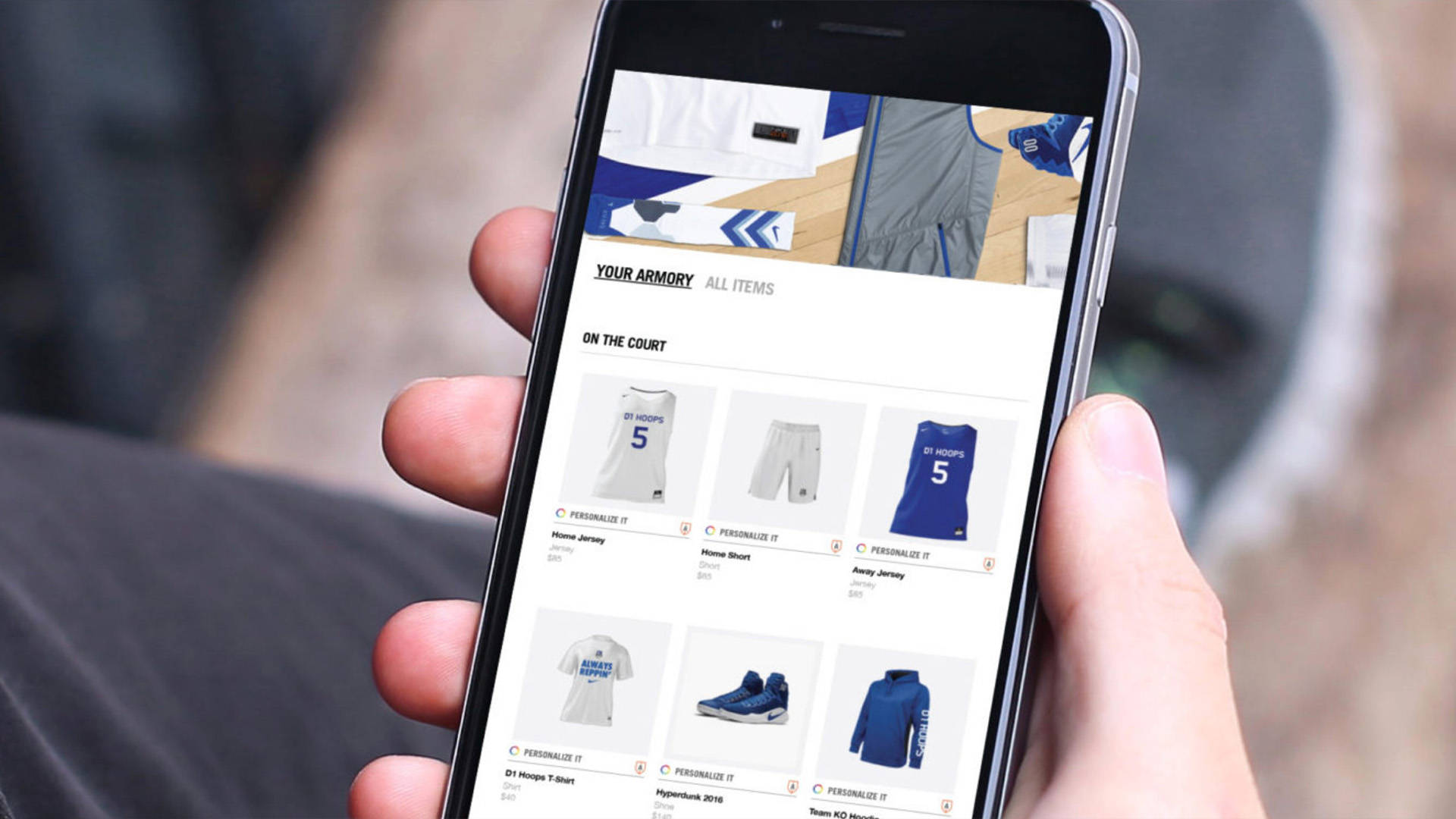 Handheld smartphone showing a Nike e-commerce app.