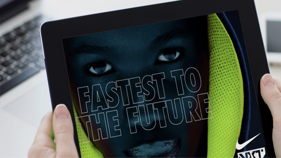 Handheld tablet showing image of athlete and Nike "Fastest to the Future" logo.